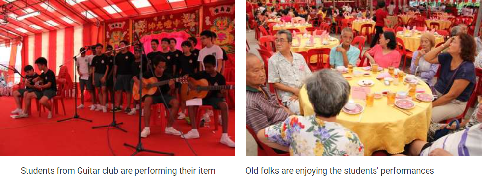 Students perform guitars under a red tent while elderly people sit at round tables watching nearby.